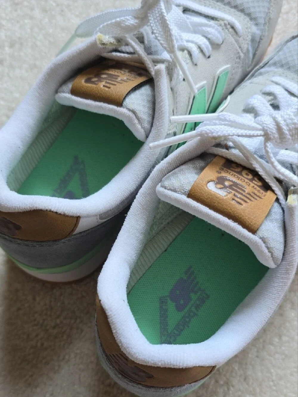 New Balance sneakers in mint green and light gray